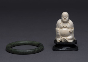 Chinese carved ivory Buddha statue and carved spinach jade bangle, mid 20th century, Buddha 8.5cm overall