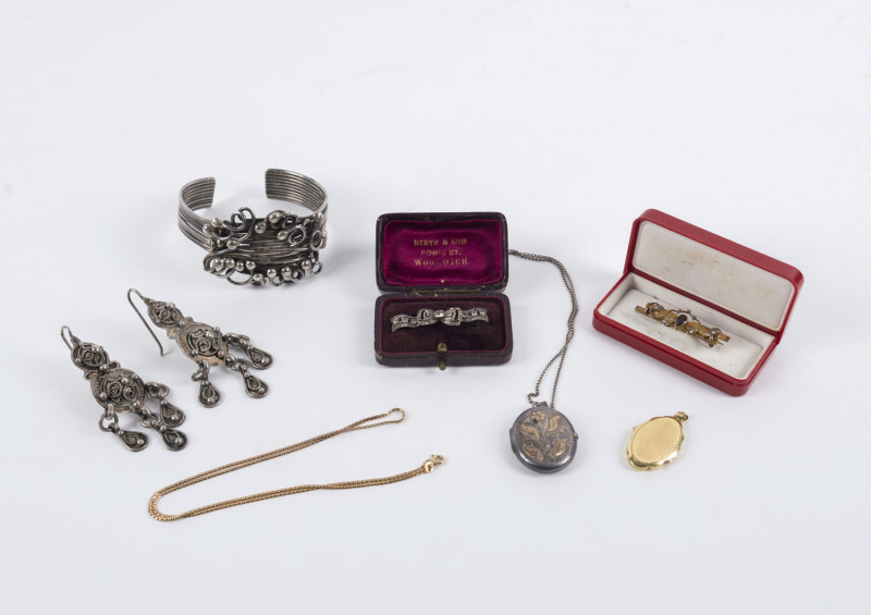 Moroccan silver bangle and earrings, silver locket and chain, 9ct gold necklace, 9ct gold bar brooch set with seed pearls and garnet, ​and a photo locket, 7 grams of gold, 140 grams of silver