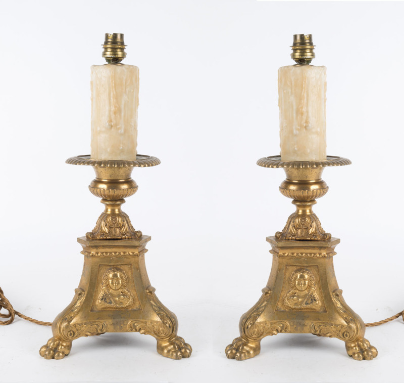 A pair of French table lamps in the form of baronial candle stands, early 20th century, 40cm high