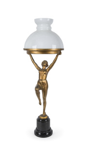 A French Art Deco figural lamp, gilt metal with milk glass shade on black marble base, circa 1930, ​75cm high
