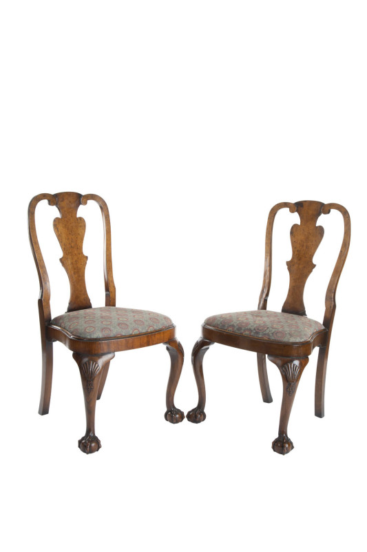 A pair of Chippendale dining chairs, walnut with carved claw feet, 18th century