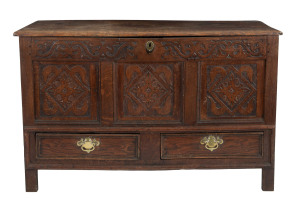 An English coffer, carved oak with brass handles, 18th century, 69cm high, 110cm wide, 49cm deep