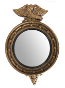 A convex circular gilt frame mirror, English, early 20th century, ​63cm high