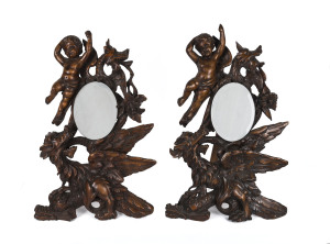 A pair of French table mirrors, ornately carved fruitwood with cherubs and griffins, mid 19th century, 65cm high
