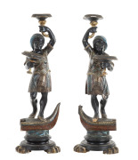A pair of Italian Blackamoor pedestals, original polychrome finish on carved timber, 19th century, ​84cm high