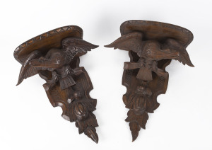 A pair of Black Forest wall brackets with carved eagles, 19th century, 45cm high