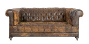 A Chesterfield settee, brown button back leather with timber bun feet, early 20th century, ​200cm across the arms