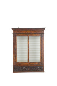 A continental wall mounted display cabinet, carved walnut and glass, 19th century, 56cm high, 43cm wide, 22cm deep