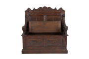 A Continental hall seat, carved oak with lions head hand grips, 19th century, ​108cm high - 2