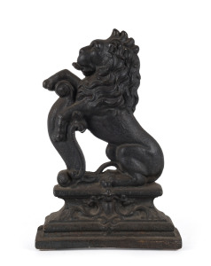 An English cast iron door stop in the form of a rampant lion, 19th century, 37cm high