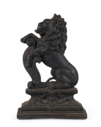 An English cast iron door stop in the form of a rampant lion, 19th century, ​37cm high