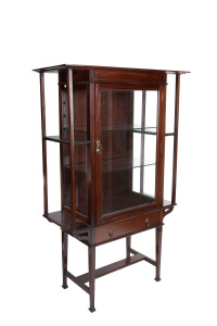 An English Arts and Crafts display cabinet, walnut and glass with brass handles, late 19th century, 159cm high, 104cm wide, 43cm deep