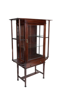 An English Arts and Crafts display cabinet, walnut and glass with brass handles, late 19th century, 159cm high, 104cm wide, 43cm deep