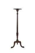 A torch&egrave;re, turned and carved mahogany, 20th century, 125cm high