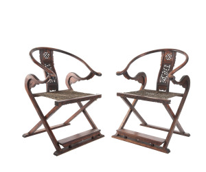 A pair of Chinese yoke chairs, carved wood and fibre, 20th century,103cm high, 74cm wide, 58cm deep