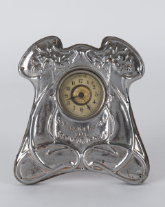 An English Art Nouveau silver plated table clock emblazoned "So Runs The Round Of Life From Hour To Hour", circa 1900, ​16.5cm high