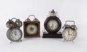 Four antique German alarm clocks, 19th and 20th century, the tallest 26cm high PROVENANCE The Tudor House Clock Museum, Yarrawonga