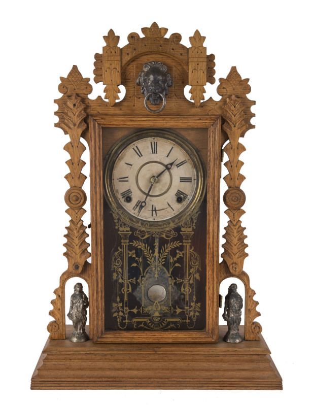 INGRAHAM Co. "Shekel" American parlor clock, 8 day movement in oak case with two statuettes, circa 1891, ​56cm high PROVENANCE The Tudor House Clock Museum, Yarrawonga