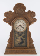 INGRAHAM "Urania" gingerbread parlor clock, 8 day movement with calendar dial, circa 1907, ​57cm high