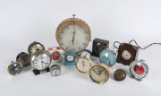 Sixteen assorted clocks, early to mid 20th century, Smith clock 21cm high