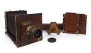 Unknown maker: A half-plate mahogany & brass Tailboard camera, circa 1870s, with original leather bellows, lens by Alexis Gaudin of Paris (#693) with cap, two double dark slides, a tripod and platform.
