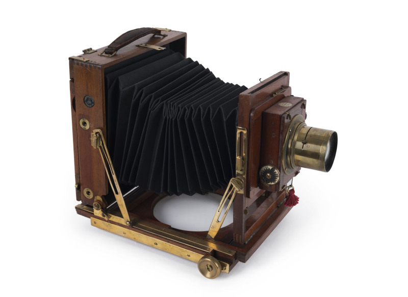 HOUGHTON mahogany & brass ½-plate field camera, double extension J.H. Dallmeyer No.5, Series 4 Carfac 6.3/f10" (25.5cm) lens (#81845) mounted on a Thornton Pickard shutter; replacement bellows.