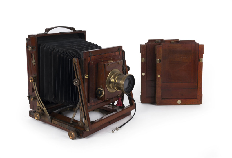 HOUGHTON: Sanderson mahogany & brass half-plate field camera with Thornton Pickard Rectoplanat f8 lens, original leather bellows, rack and pinion movement; two double dark slides.