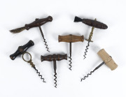 Six antique corkscrews, iron and brass with turned wood and ivory handles, two with bristles, 18th and 19th century, ​the tallest 15.5cm high