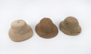 Three Pith helmets, 19th and 20th century,