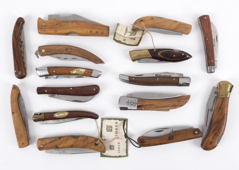 Fourteen assorted folding pocket knives with wooden handles, including LAGUIOLE G. DAVID, L'AURILLAC, SAYNOR, JOKER, and Le CAMARGUAIS, France, England and Spain, the largest 21.5cm long