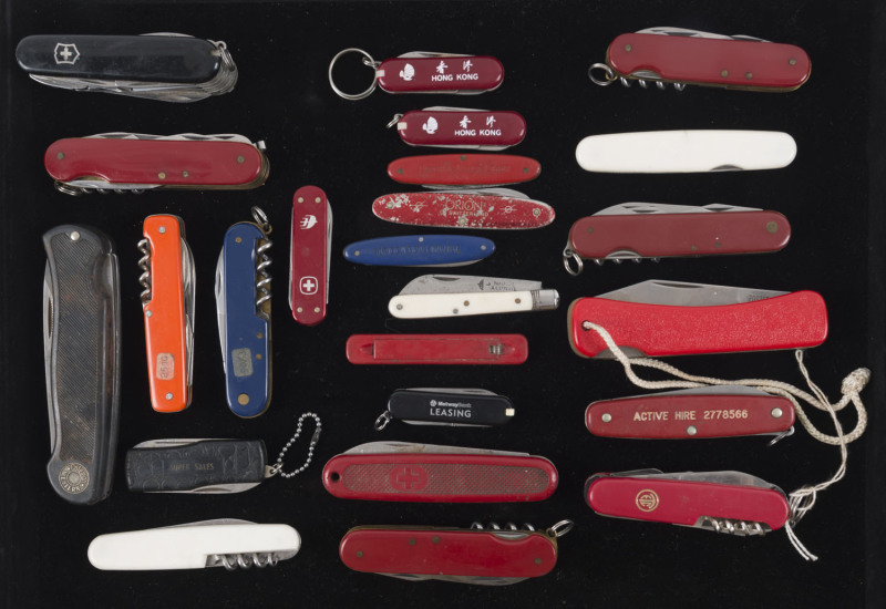 Twenty four assorted pocket knives and multi-tools including Swiss Army, 20th century, ​the largest 22cm long