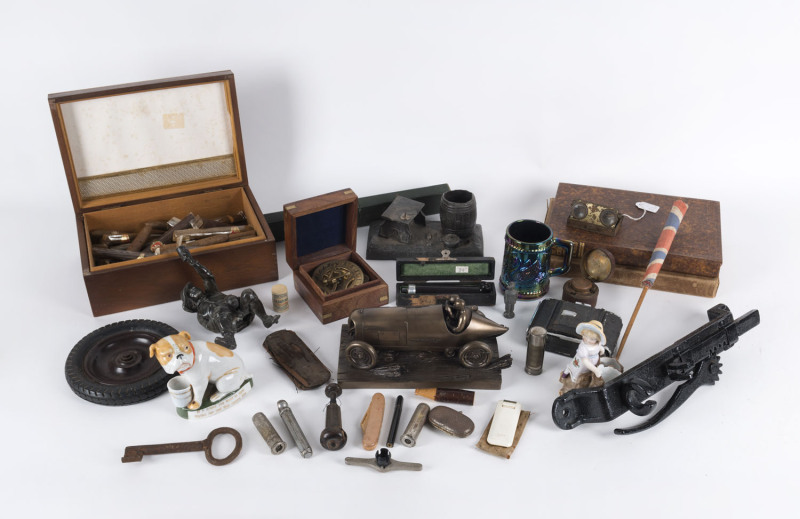 Remains of collection including BLITZEN BENZ statue, porcelain match holders, pince-nez, cigar box and cigars, inkwell, cork extractor, ephemera, photo album, book, micrometer etc (38 items), the Benz statue 23cm long