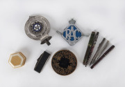 Two auto badges, powder compact, jewellery box, brush and five assorted pens and pencils, 19th and 20th century, 