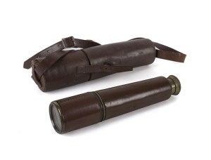 A brass and leather bound telescope in original leather case, early 20th century, 26.5cm expands to 80.5cm long