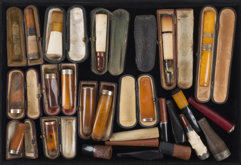 Group of 24 cigar holders, amber and meerschaum with gold and silver mounts, 12 in leather cases, 19th and early 20th century, ​the largest 10.5cm long