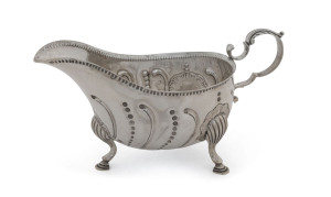 An Irish sterling silver gravy boat, Dublin mark stamped "J.S.", circa 1901, ​18.5cm across, 230 grams