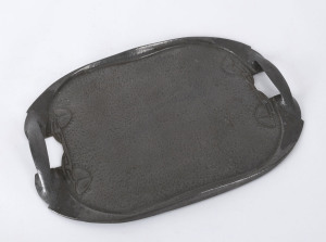 LIBERTY & Co. Arts and Crafts serving tray, beaten pewter, early 20th century, stamped "English Pewter Made By Liberty & Co.", 50cm across the handles