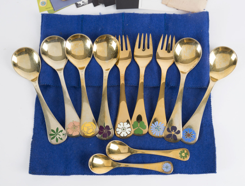 GEORG JENSEN set of six Danish sterling silver and enamel year spoons with gold plated finish, together with 3 matching forks and 2 teaspoons, circa 1970s, with certificates, 440 grams total