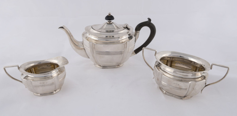 A three piece sterling silver tea service by William Drummond, Birmingham, circa 1907, the teapot 15cm high, 570 grams total