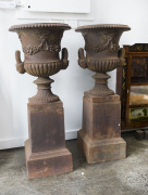 A pair of antique cast iron garden urns, late 19th century, ​112cm high