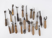 CAN OPENERS: Group of 19 antique and vintage examples with turned wooden handles, 19th and 20th century, the largest 27cm high