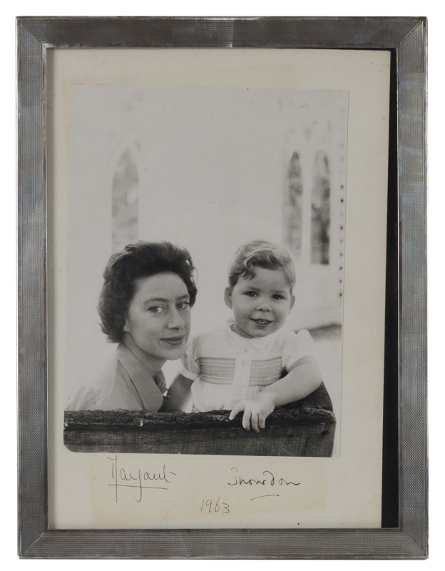 PRINCESS MARGARET [1930-2002] and her first child, Viscount David Linley photographed by her husband Lord Snowdon, 19 x 14cm, mounted on a backing card and endorsed on reverse "With Christmas Wishes"; signed and dated on the mount below "Margaret", "Snowd
