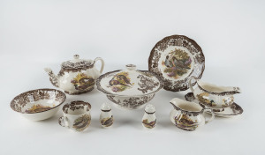 The Royal Worcester Group "Palissy Games Series" porcelain dinner set for 8 places including entree and dinner plates, soup bowls, teacups, saucers and side plates, teapot, jug and sugar bowl, 2 meat platters, tureen, gravy boat and saucer plus condiments (58 pieces).