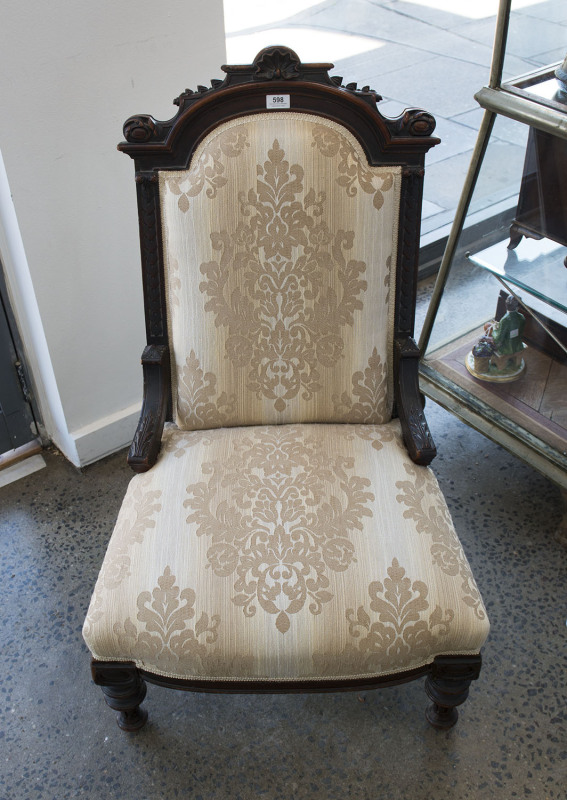 A ladies salon chair, carved walnut with brocade upholstery, circa 1885, 93cm high