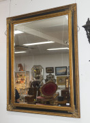 A gilt framed mirror with beveled glass, 20th century, 115cm x 146cm