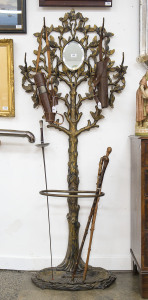 An American cast iron hall tree with patinated finish, mid 19th century, ​185cm high