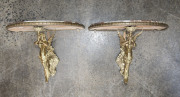 A pair of French figural demi-lune wall brackets, gilt metal and rogue marble, 19th century, 30cm high, 42cm wide, 27cm deep
