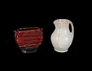 Crown Ducal cream glazed landscape jug and a burgundy glazed Art Deco vase, circa 1930 stamped "DUCAL, Made In England". (2 items), the tallest 21cm