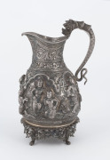 A Burmese silver jug with high relief repousse work, 19th century, ​18cm high, 370 grams - 2