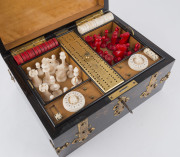 An impressive antique games box, coromandel and satinwood with brass fittings. Interior fitted with compartments, lift out tray and double-sided games board. Includes a fine array of carved bone and ivory gaming pieces comprising chess, draughts and backg - 4